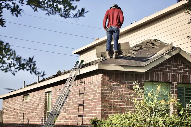 Professional roofer working on a residential roof in Lodi Center